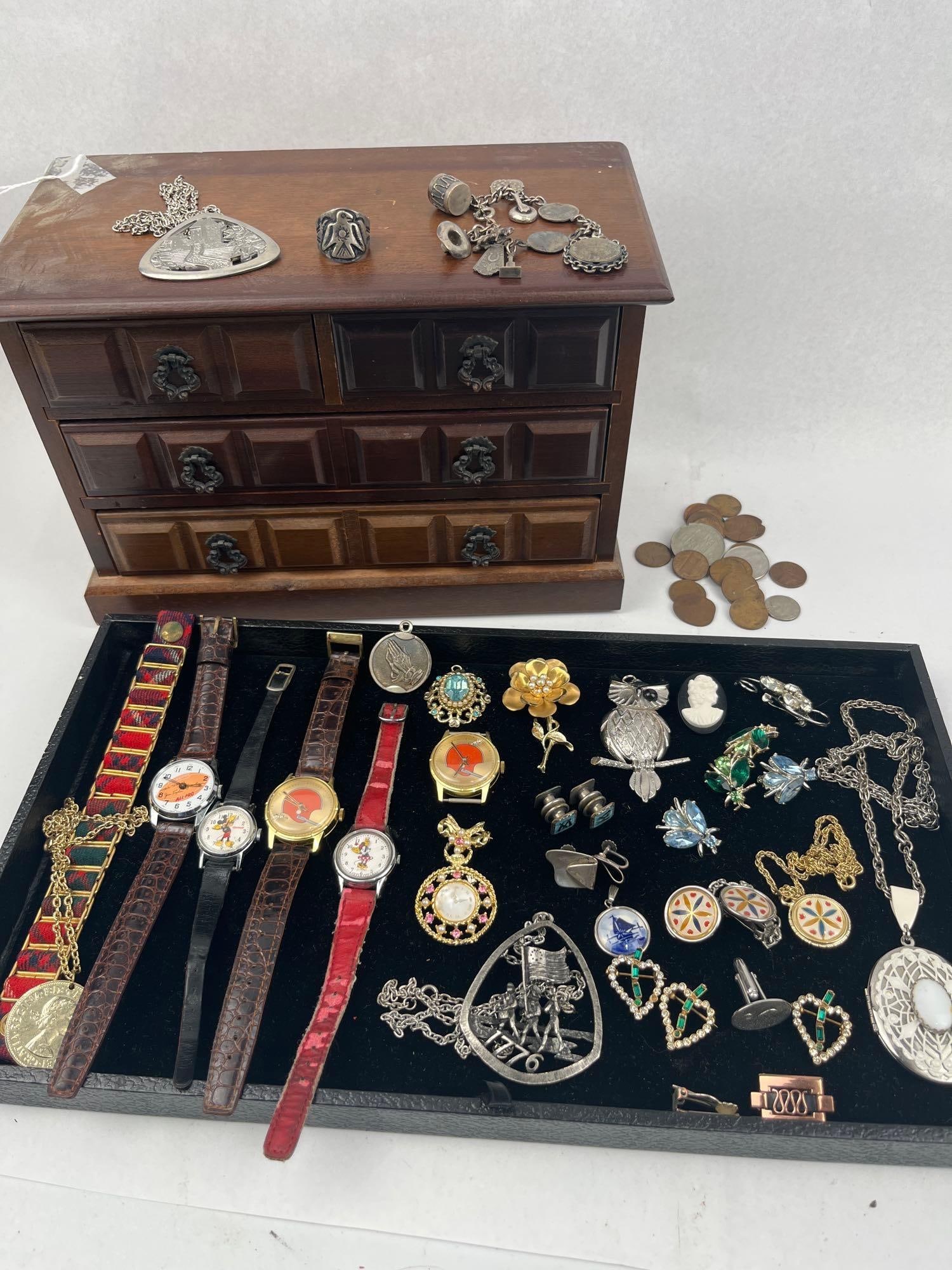 Costume Jewelry, Watches & Coins: A miniature four-drawer jewelry chest constructed of dark mahogany-toned wood, featuring two small top drawers above two full-width bottom drawers. The drawers are fitted with ornate brass-toned drop 