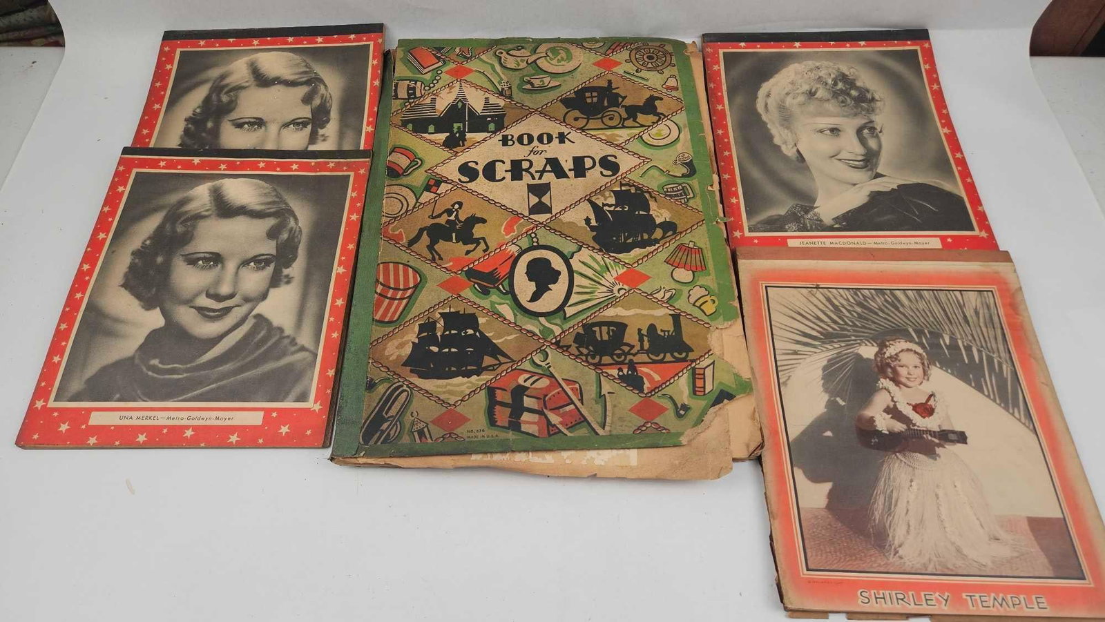 1930s Hollywood Movie Star Ephemera: A collection of vintage paper ephemera consisting of star-themed booklets and a larger scrapbook. The booklets feature covers with 1930s movie stars, including Jeanette MacDonald, Una Merkel, and Shir