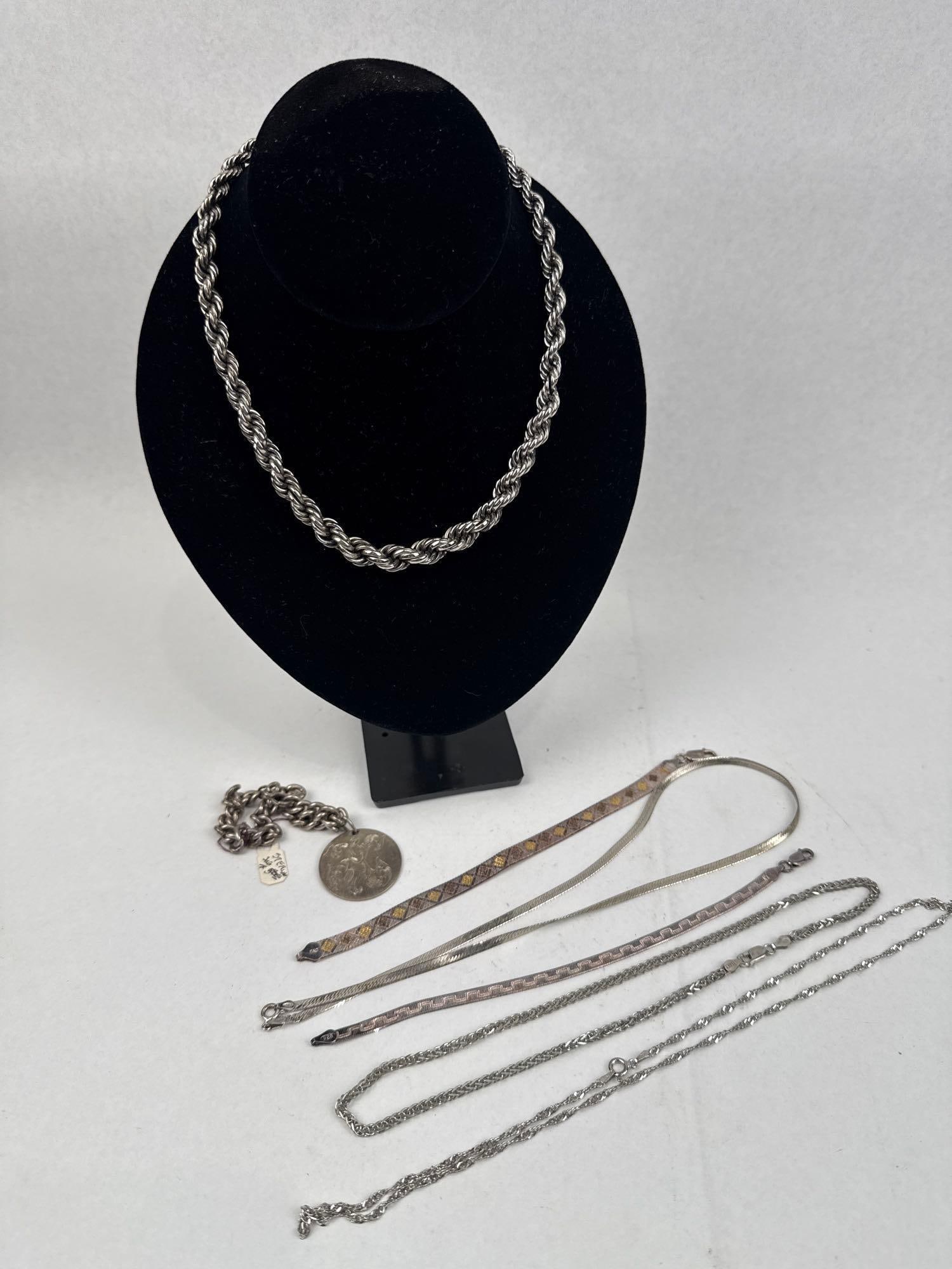 Str. Jewelry w/ Chains & 1945 Medallion: This group features several sterling silver jewelry pieces in various lengths and link styles. Included are two rope-twist chains, one of substantial thickness and one of a finer gauge. The