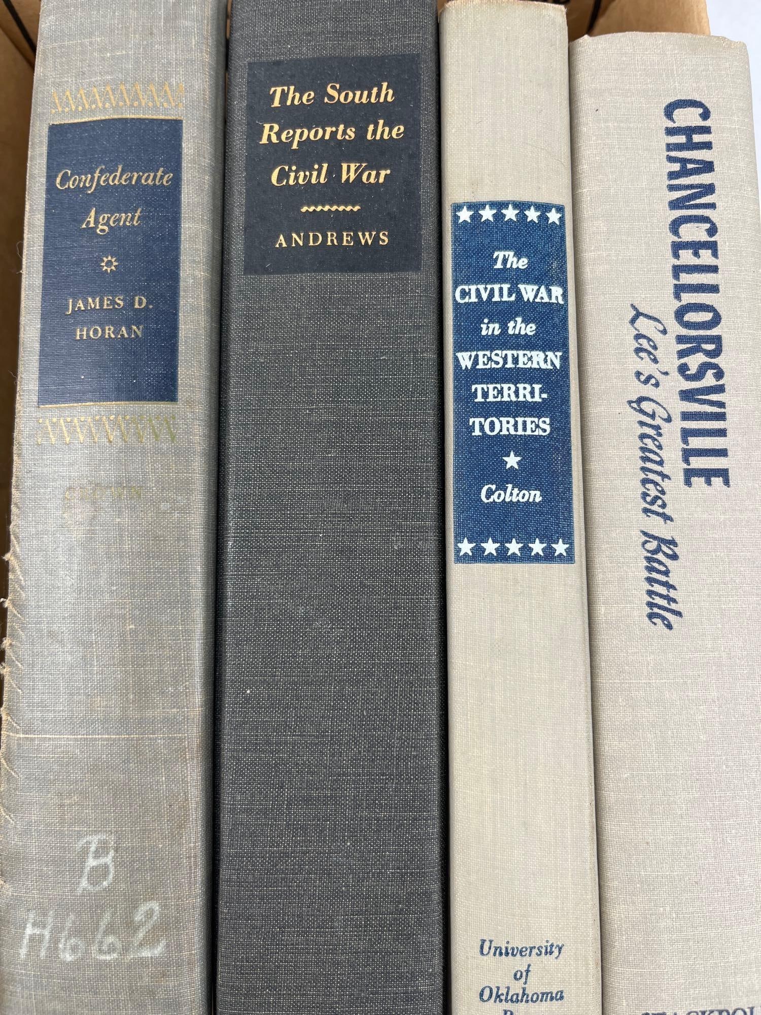 Civil War History Hardcover Books: A group of cloth-bound hardcover books examining various facets of the American Civil War, including military strategy, the role of the press, and clandestine operations. The collection features