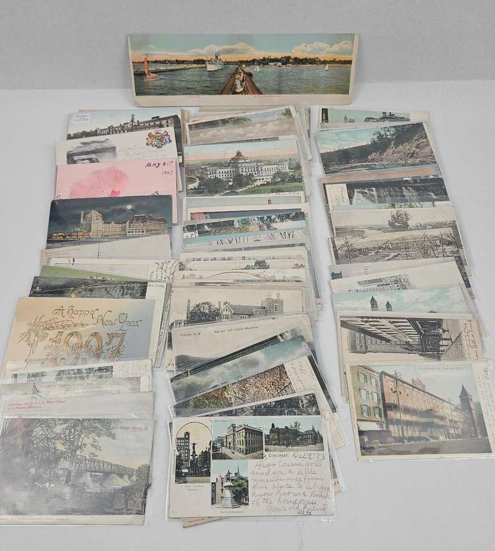 Early 20th C. Topographical Postcards: An assortment of vintage early 20th-century postcards, with many examples dating from 1906 to 1907. The group includes a range of topographical views, cityscapes, and holiday greetings, notably a Happ