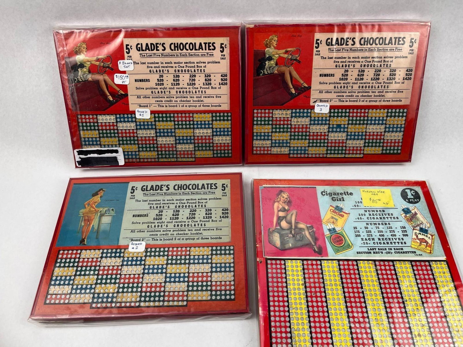 Glade's & Cigarette Girl Punch Boards: This collection features four unpunched mid-20th-century merchandise punch boards constructed of color-printed cardstock on heavy fiberboard. The group includes a set of three boards branded for