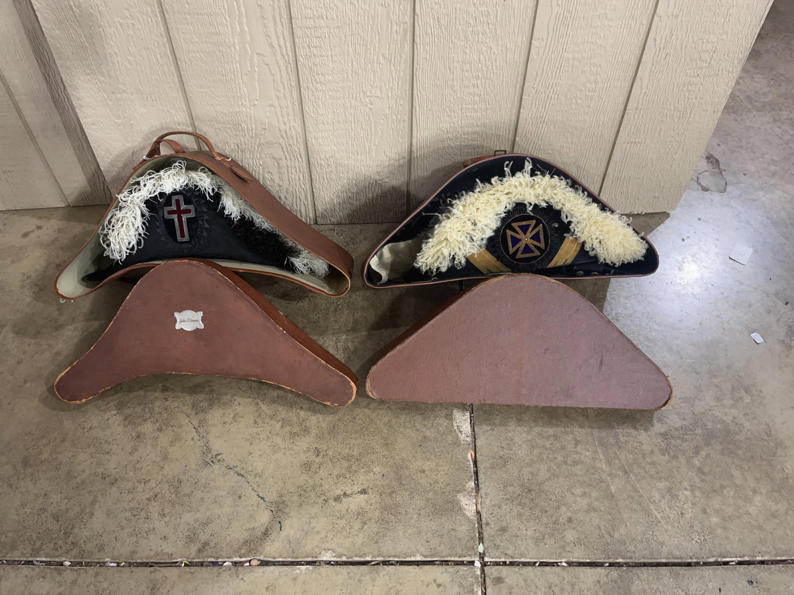 Masonic Knights Templar Regalia & Cases: This group of Masonic Knights Templar ceremonial regalia consists of multiple bicorne chapeaux, their respective fitted leather cases, and dress gloves. One chapeau is constructed of black felt adorne