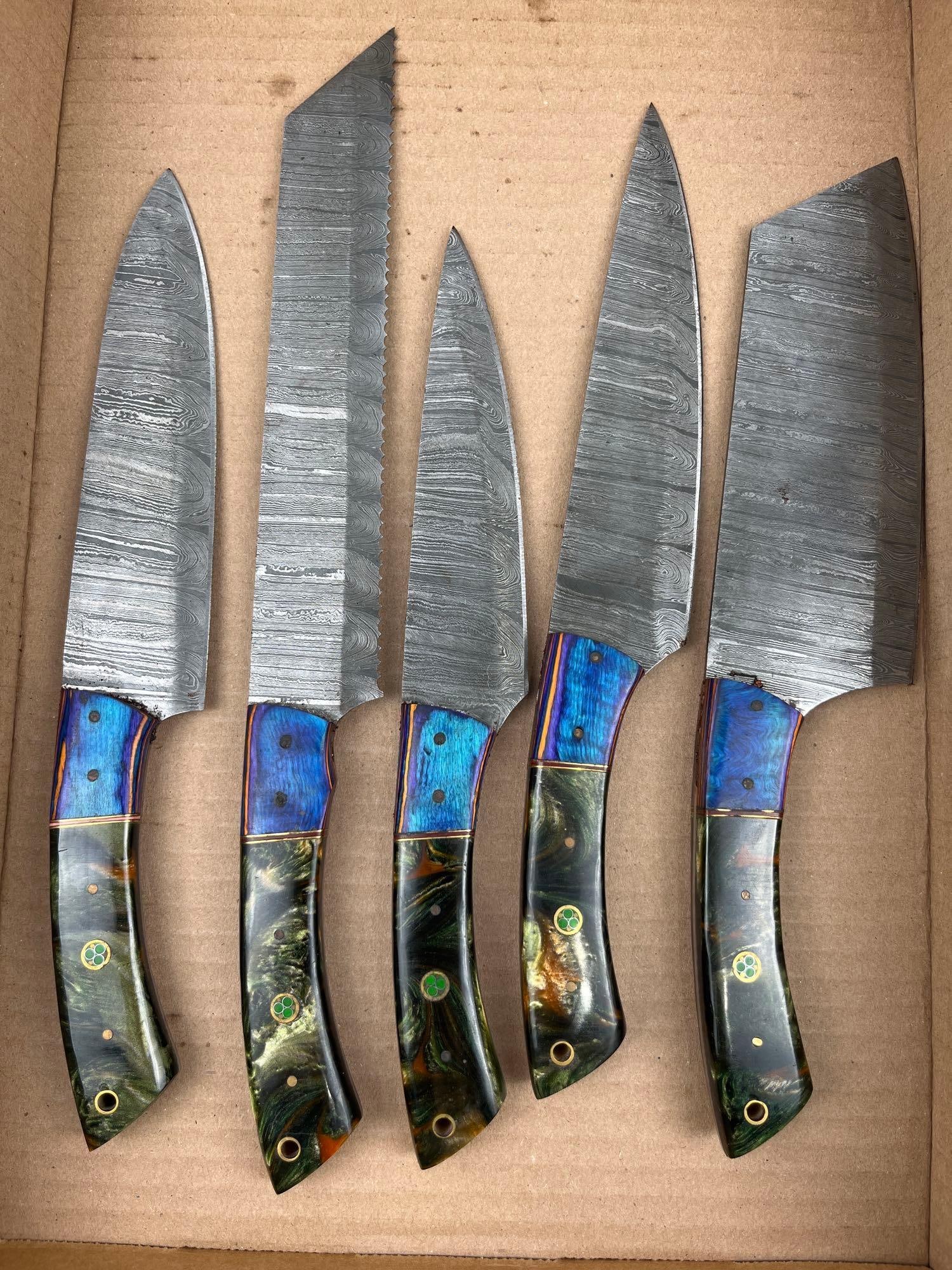 Damascus Steel Culinary Knife Set: A set of contemporary kitchen knives featuring pattern-welded Damascus steel blades in various profiles, including a curved chef knife, a serrated utility knife with a reverse tanto tip, a petty
