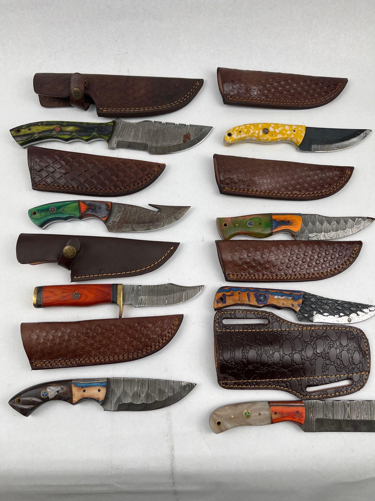 Damascus Steel Knives & Leather Sheaths: A collection of custom-style fixed-blade knives, each featuring a Damascus steel blade displaying various patterns such as ladder, twist, and raindrop motifs. The blades exhibit a range of profiles in