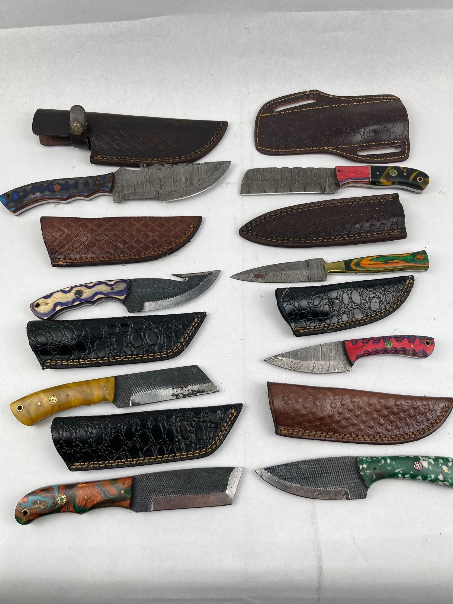 Damascus & File Steel Knives w/ Sheaths: This collection consists of several custom-style fixed-blade knives featuring a mix of Damascus-patterned steel and repurposed file steel construction. The file-steel blades retain visible tooth textu
