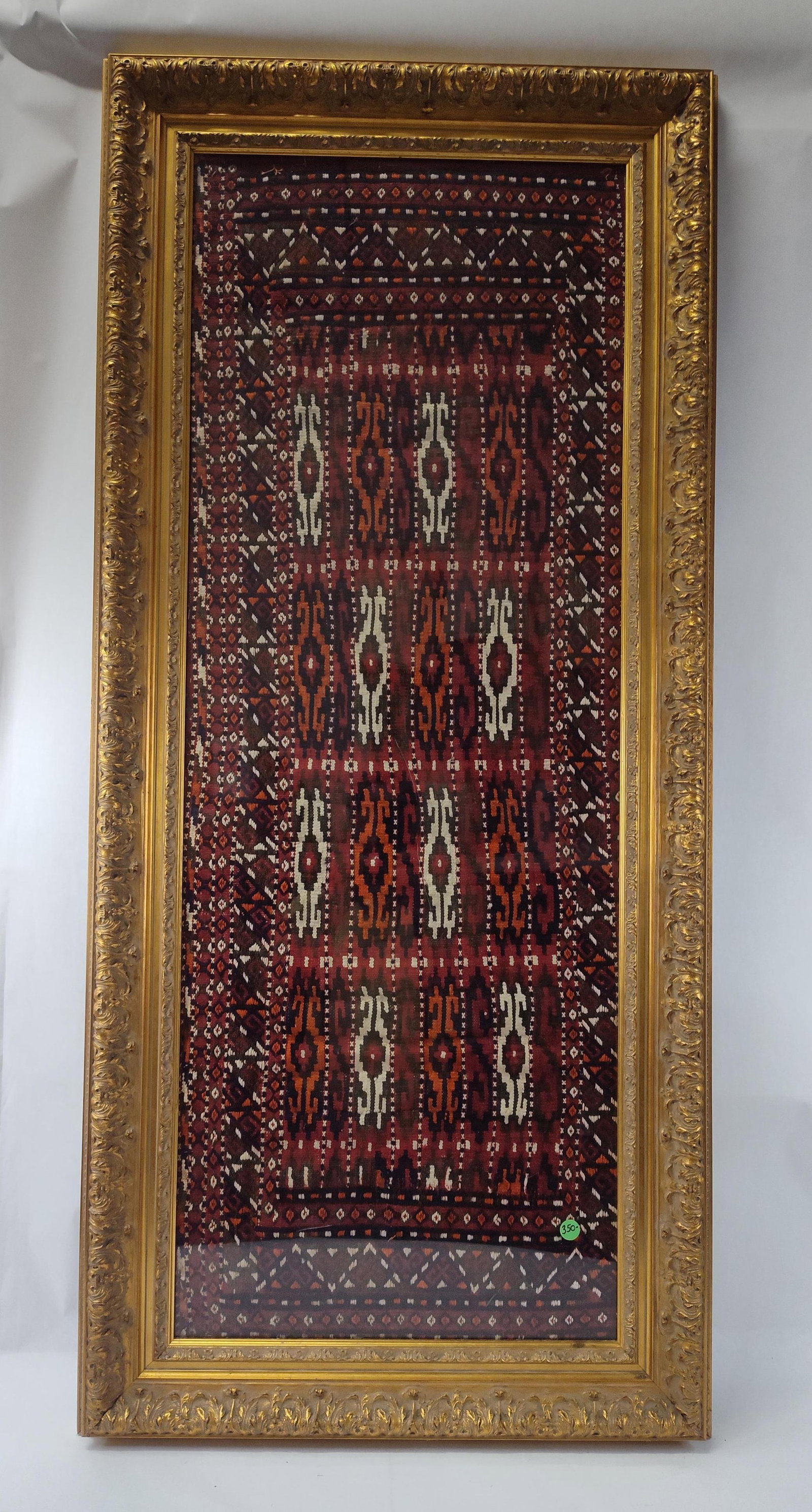 Central Asian Tribal Soumak Textile: A framed rectangular textile fragment, likely a portion of a larger tribal storage bag such as a mafrash or khorjin. The piece is executed in a flat-weave technique, specifically soumak or