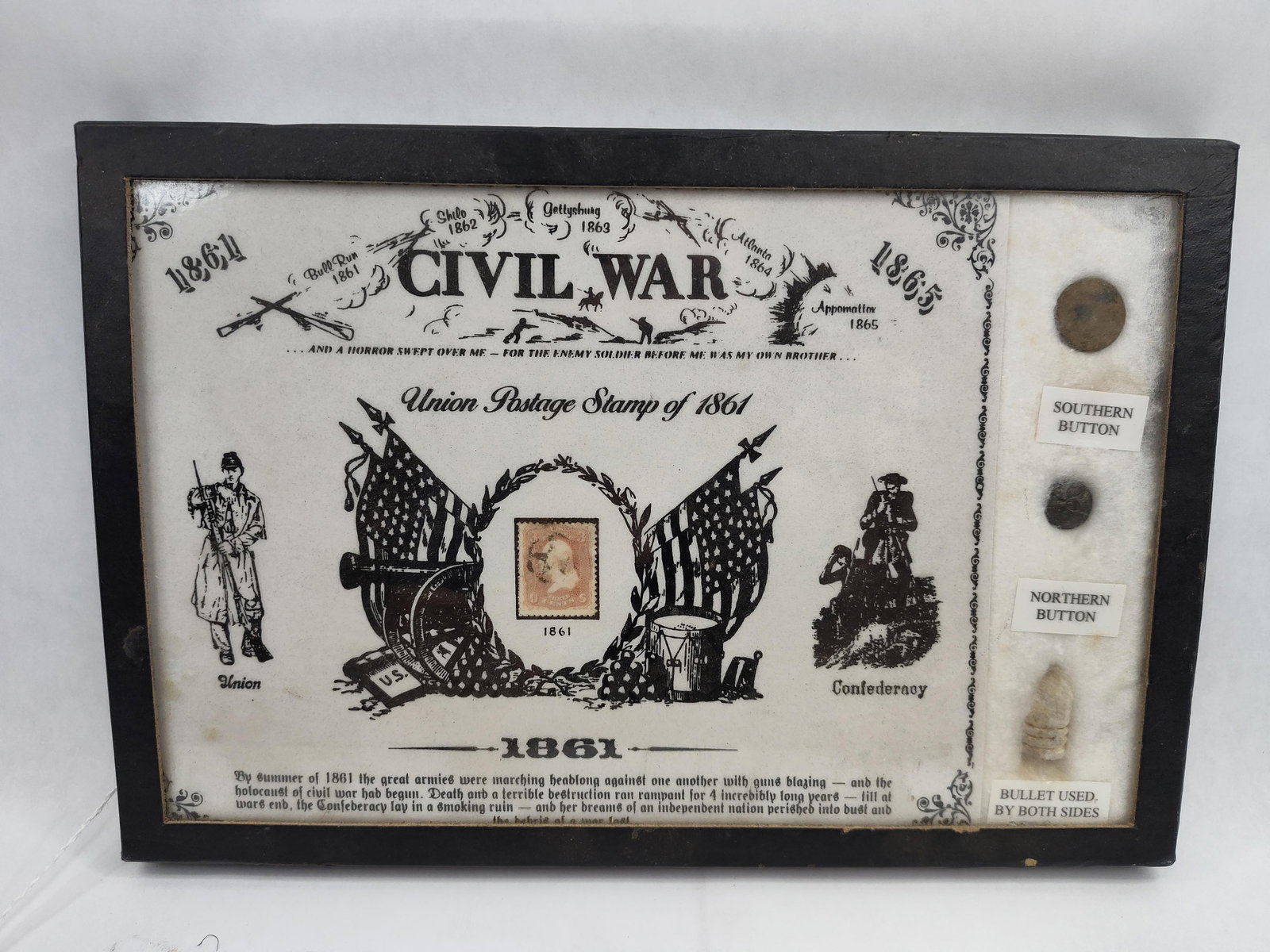 Civil War Box w/ 1861 Stamp & Artifacts: A commemorative American Civil War souvenir display case presented in a black-finished wooden frame. The central graphic backdrop features printed battle scenes and locations including Bull Run 1861,