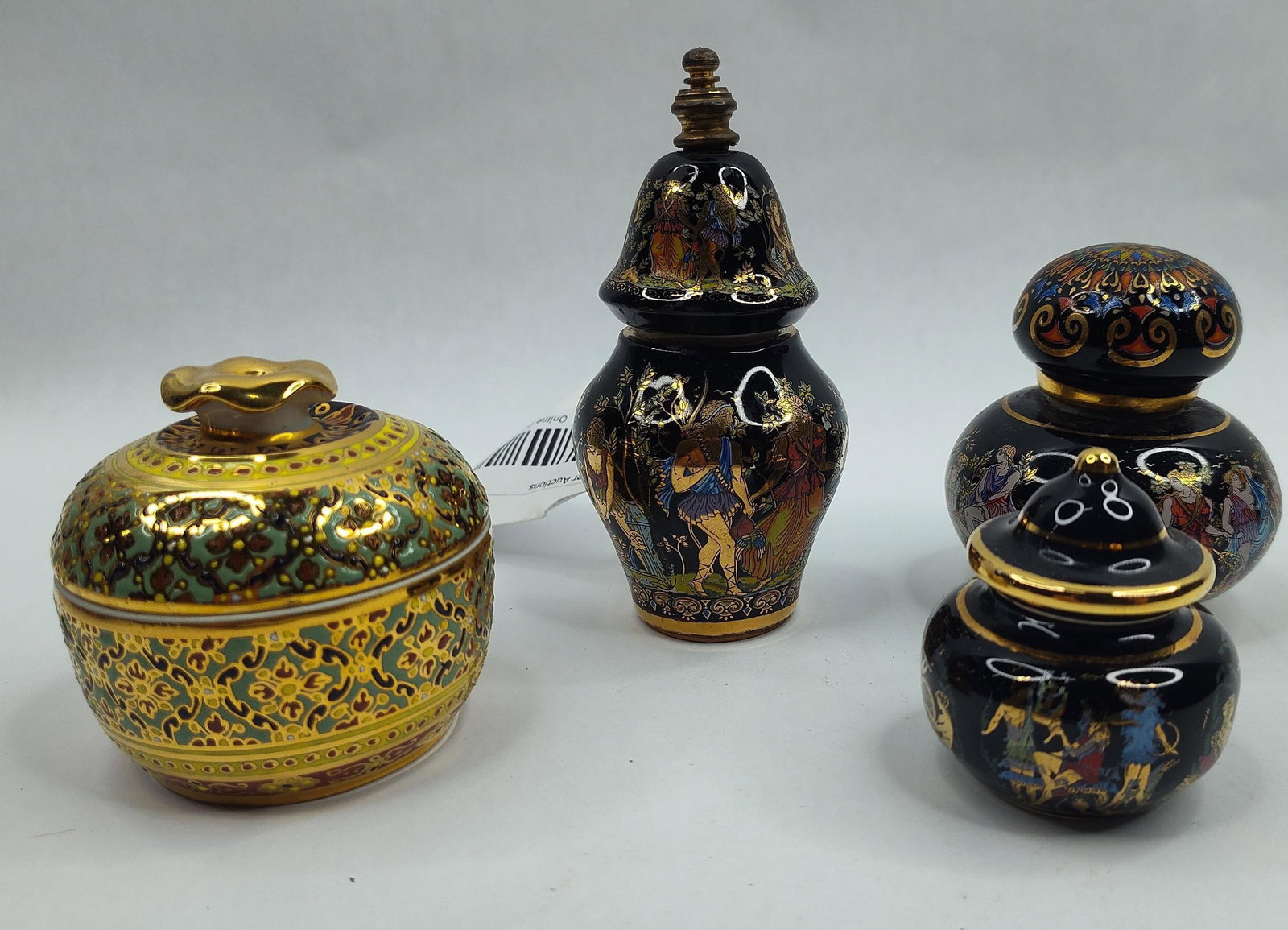 Set Benjarong & Classical Porc. Vessels: A collection of multiple miniature porcelain vessels featuring various decorative techniques. The group includes a small Thai Benjarong style covered jar with a rounded body and a domed lid topped wit