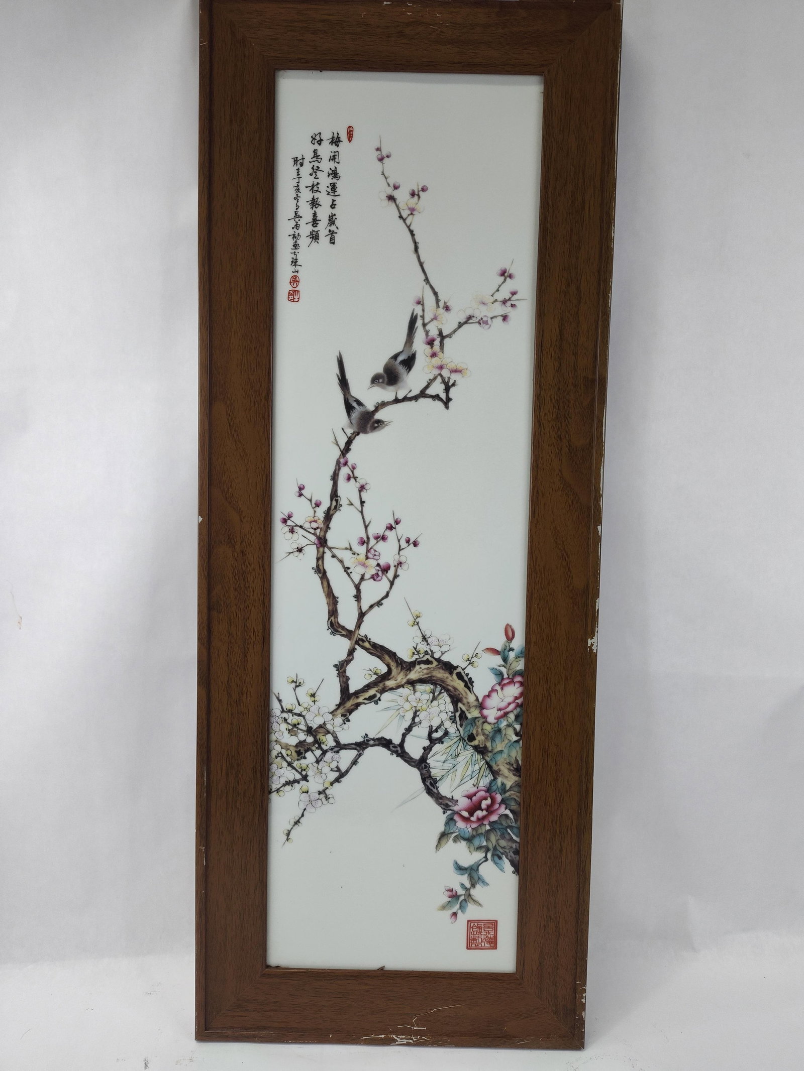 Chinese Famille Rose Porc. Plaque: A vertical Chinese porcelain plaque featuring polychrome enamel decoration in the famille rose palette. The composition depicts a gnarled flowering plum blossom tree with white and pink blossoms,