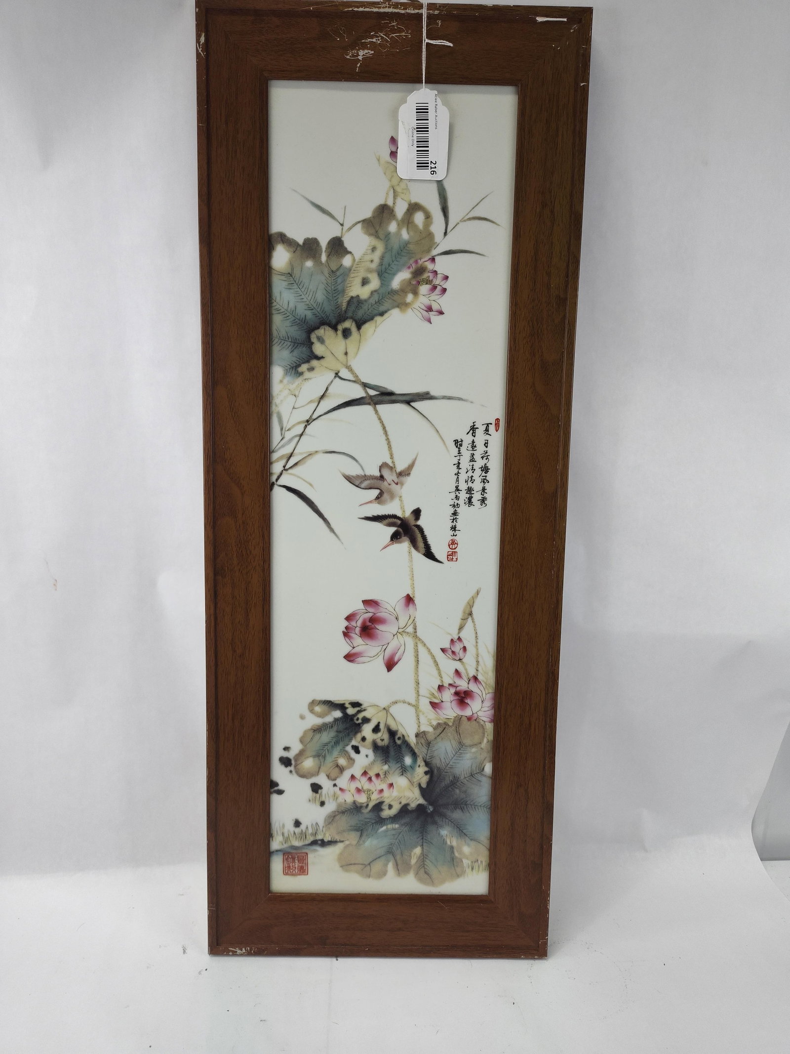 Chinese Famille Rose Porc. Plaque: A vertical Chinese porcelain plaque decorated in polychrome famille rose enamels. The composition depicts two birds in flight above a pond scene featuring blossoming pink lotuses, unopened buds, and l