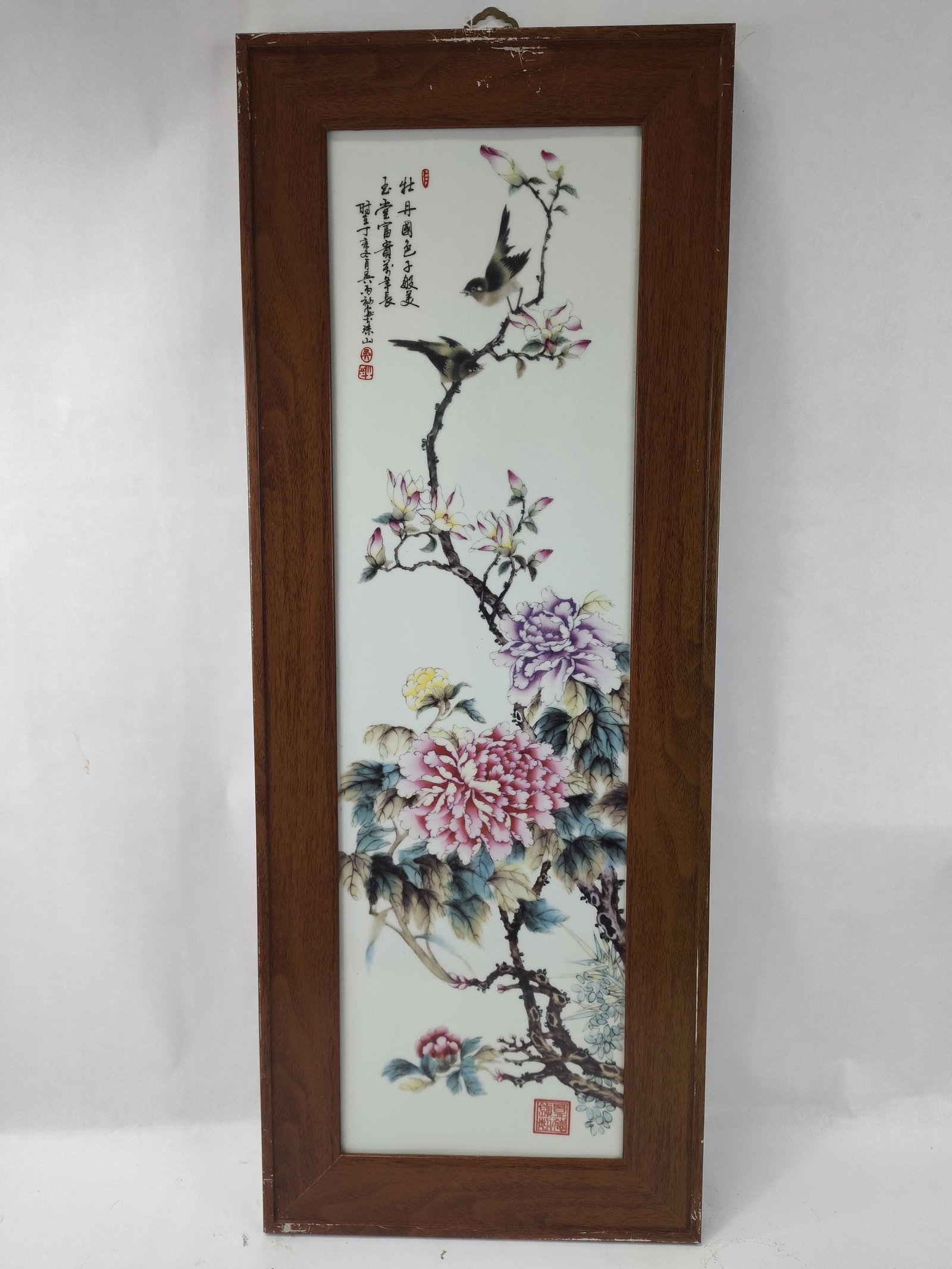 Chinese Famille Rose Peonies Porc: This vertical Chinese porcelain plaque is decorated in the famille rose palette with hand-painted enamels. The composition features two songbirds perched on a flowering magnolia branch extending from