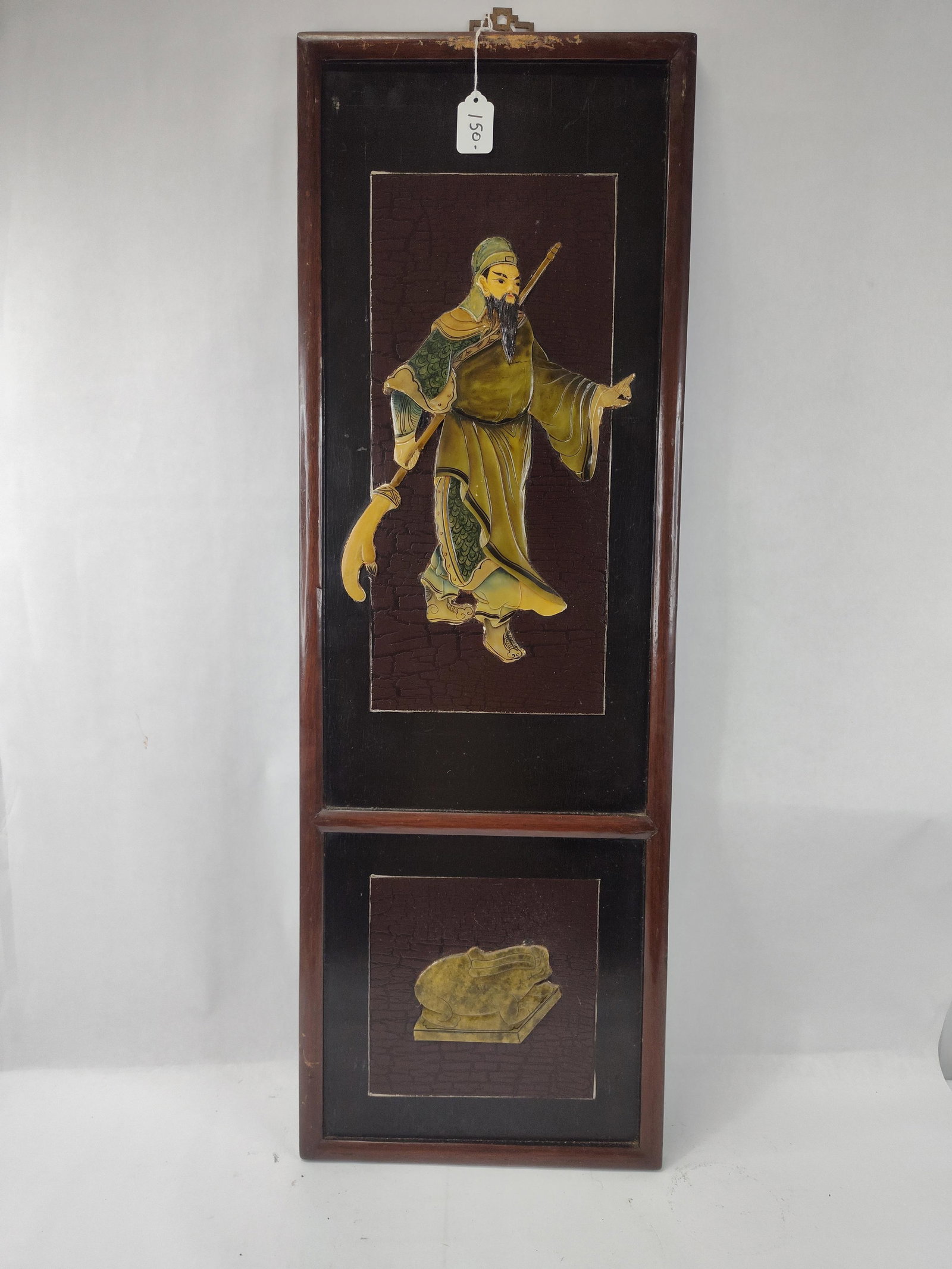 Chinese Wood Panel w/ Ceramic Figures: A Chinese vertical wall panel constructed of dark wood, featuring relief-applied figures in the upper and lower sections. The upper panel depicts a bearded warrior in traditional green and ochre