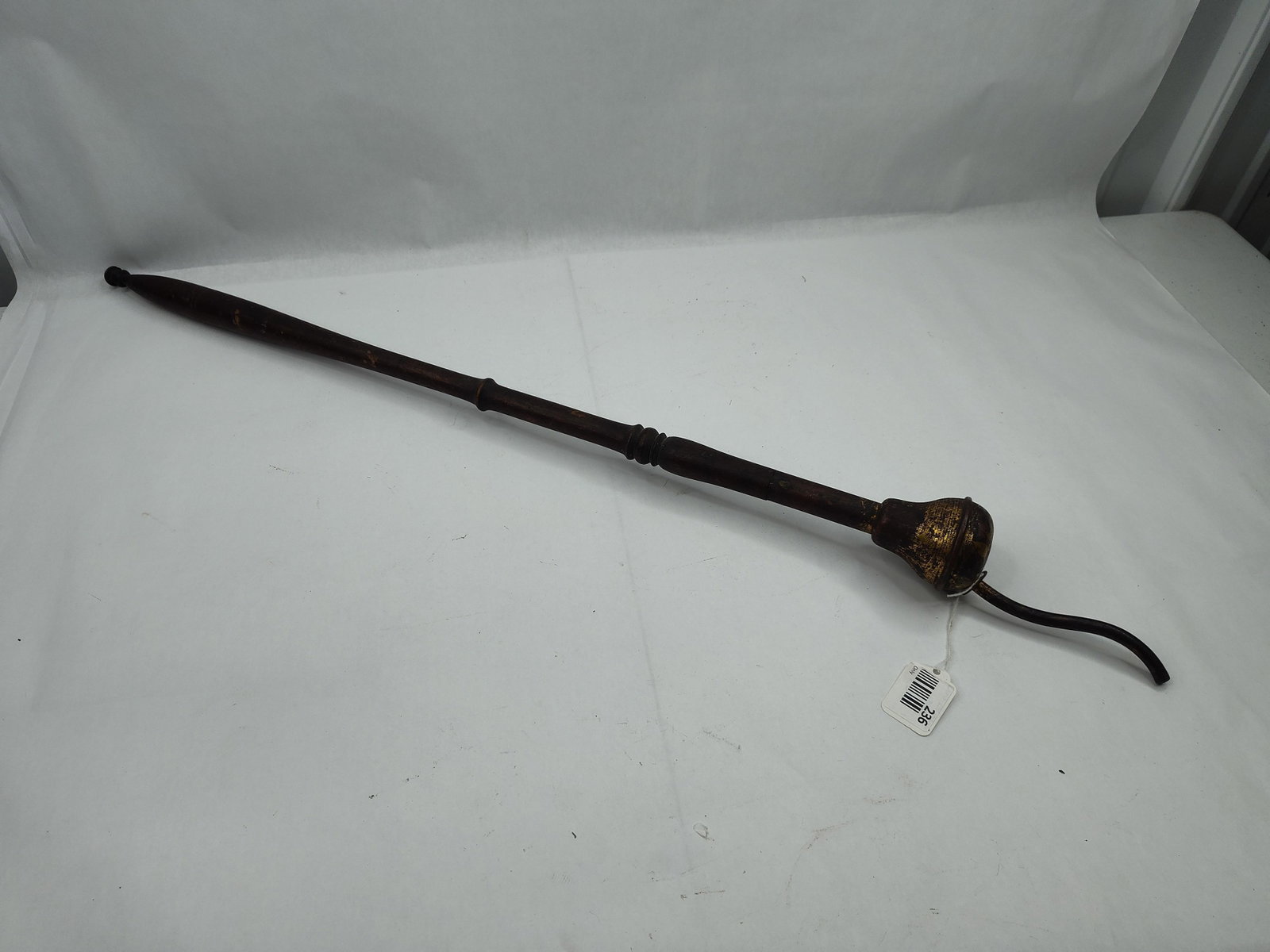 Wood & Metal Fire Blower: This handheld tool, possibly a fire blower or bellows-style duster, is constructed from turned wood and patinated metal. The long, tapered wooden handle features a series of turned decorative rings an
