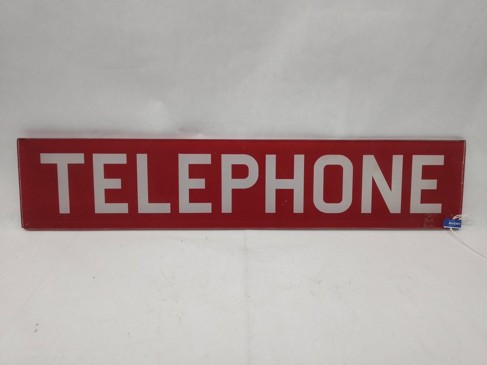 Red & White Glass Telephone Sign: A rectangular glass sign featuring the word TELEPHONE in bold white sans-serif capital letters set against a vibrant red background. The sign is constructed of a single translucent glass panel with