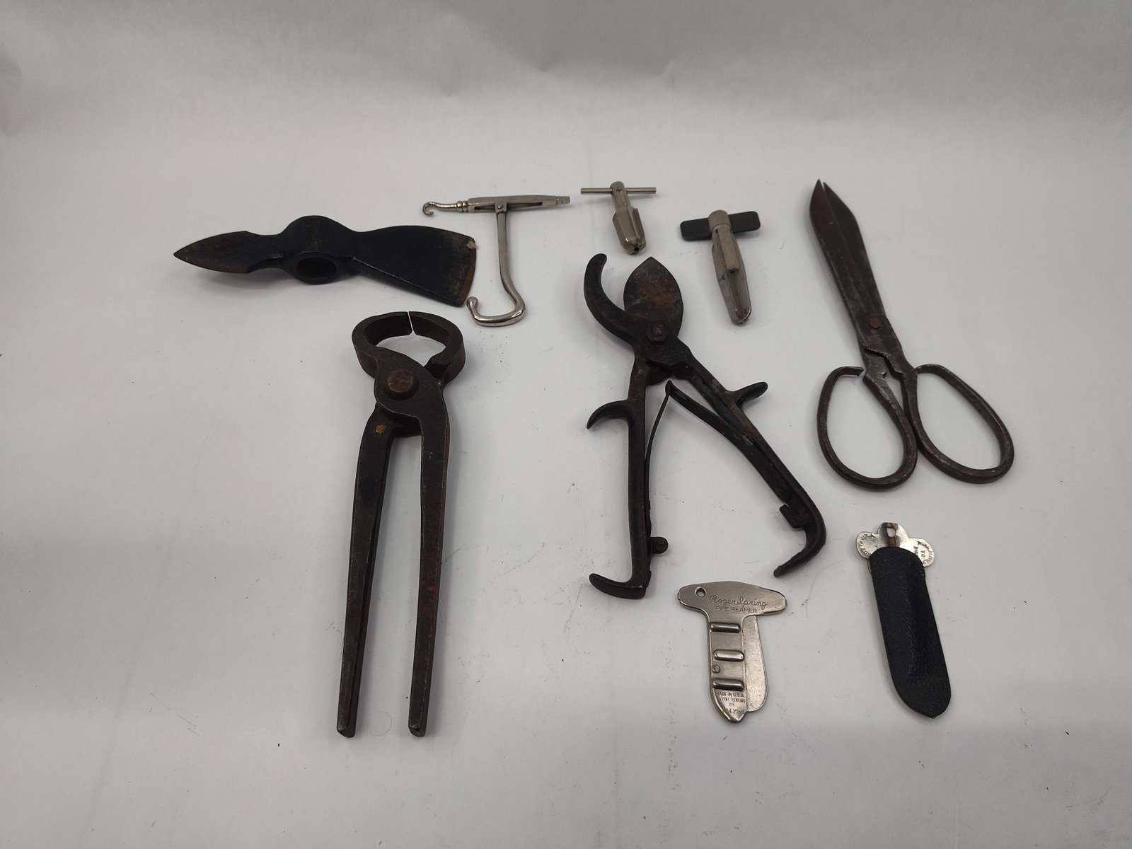 Tools & Pipe Reamers, Roger Spring: An assortment of hand tools for maintenance and general utility. The group includes several specialized tobacco pipe reamers. One folding reamer is stamped Roger Spring PIPE REAMER, MADE IN U.S.A.,