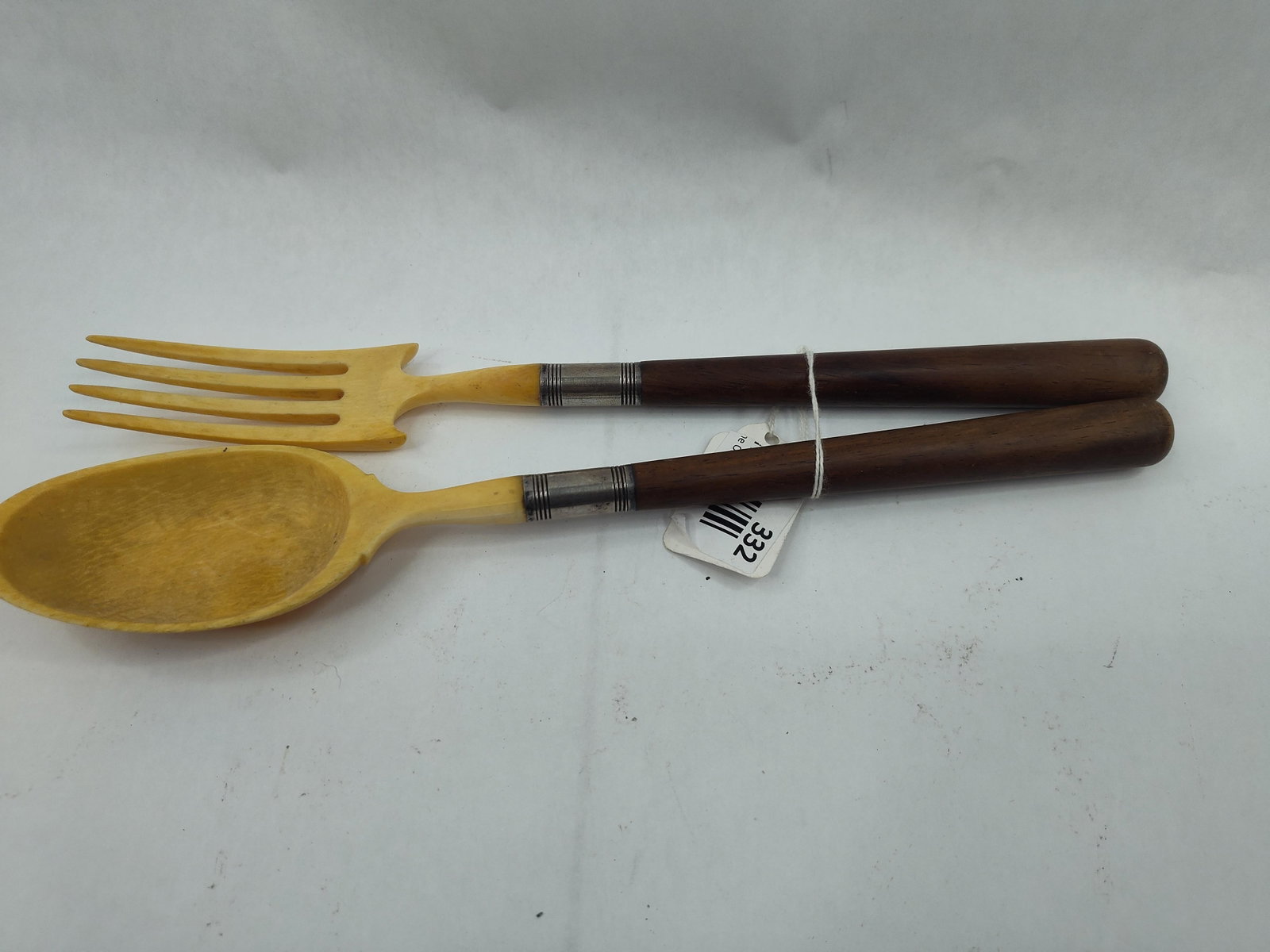 Gorham Co. Pair Wood & Bone Servers: A pair of Mid-Century Modern style salad servers comprising a four-tine fork and a large oval spoon. Each serving head is carved from a natural material, likely bone, and features a yellowish-cream