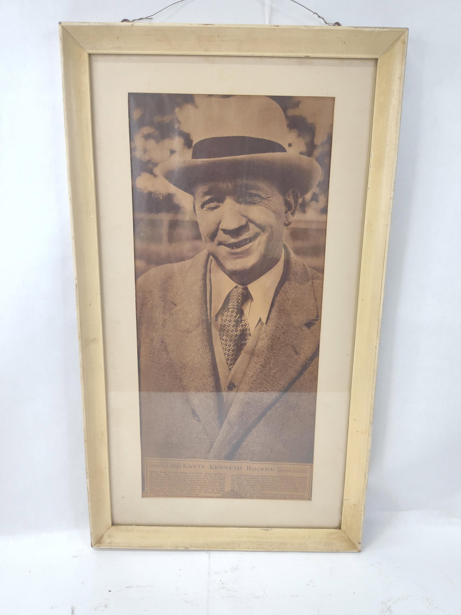 Knute Rockne Memorial Printed Tribute: A framed memorial print dedicated to Knute Kenneth Rockne (1888-1931), the celebrated football coach for the University of Notre Dame. The print features a sepia-toned photographic portrait of