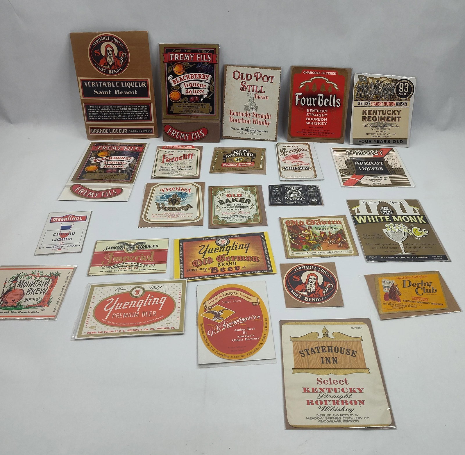 US & French Liquor & Wine Labels: A collection of paper ephemera consisting of assorted liquor, beer, and wine labels, many of which are preserved in individual clear plastic sleeves. The group includes various labels for Kentucky