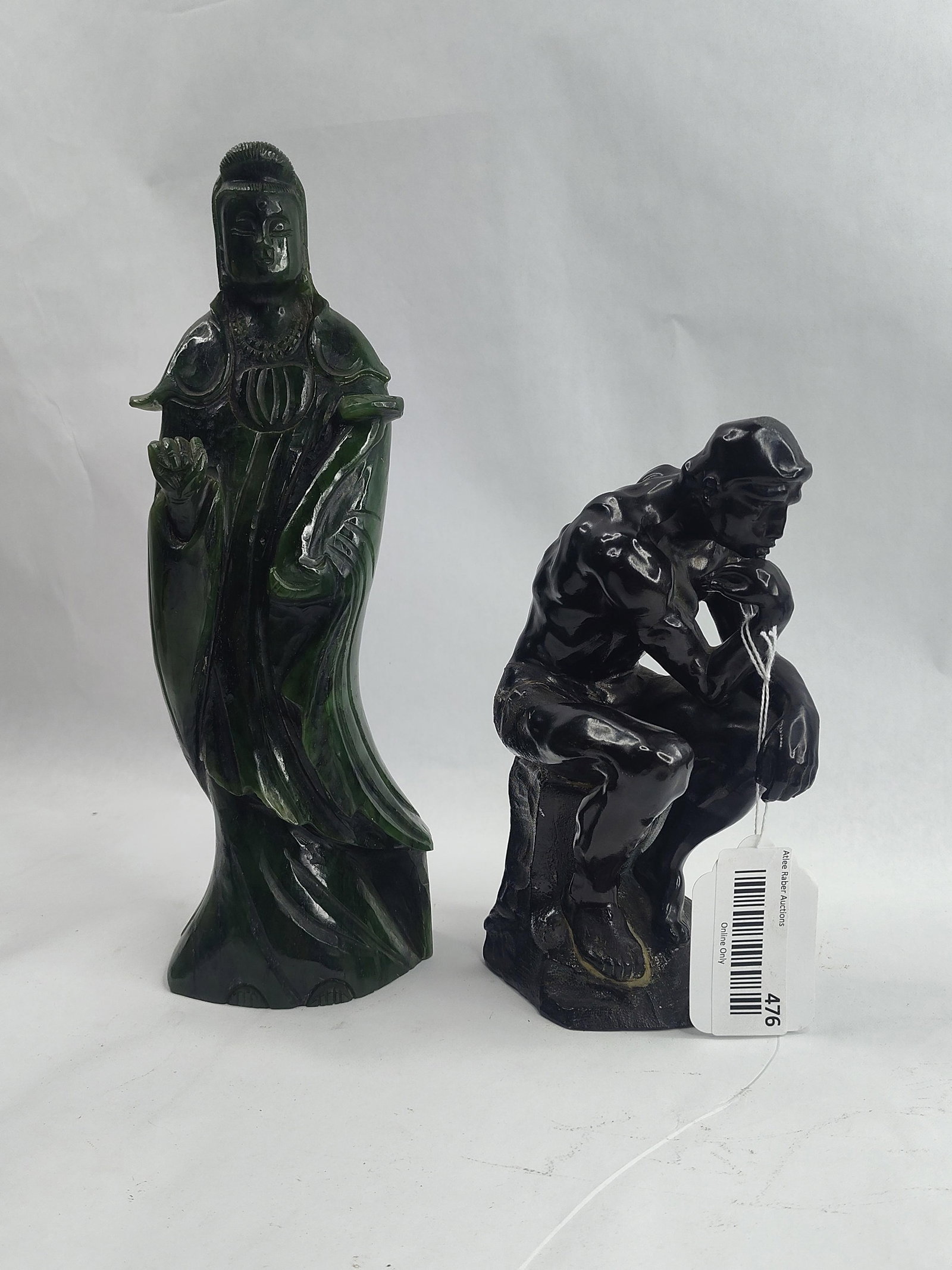 Stone Chinese Deity & Bronze Thinker: This lot consists of two decorative sculptures. The first is a standing figure of a Chinese deity, consistent with representations of Guanyin, carved from a mottled dark green and black stone. The