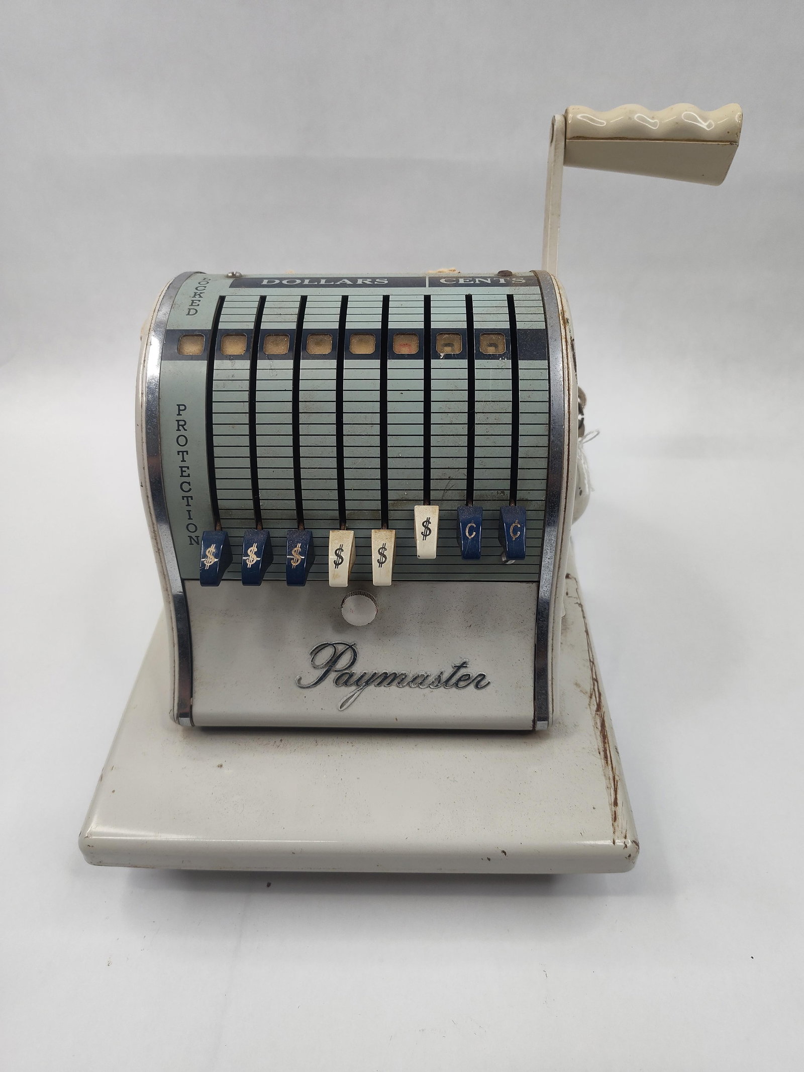 Paymaster X-2000 Check Writer w/ Keys: This Paymaster Series X-2000 mechanical check writer features a heavy metal housing with an off-white enamel finish and chrome-plated accents. The front panel displays the brand name Paymaster in a