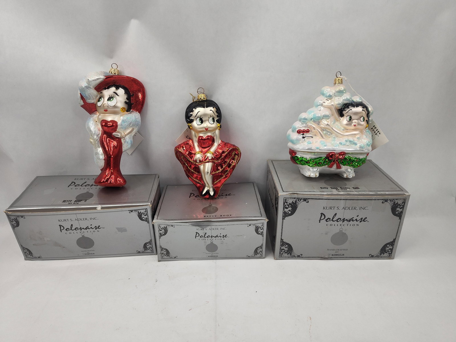 Polonaise Betty Boop Glass Ornaments: This trio of handcrafted blown glass Christmas ornaments is from the Polonaise Collection by Komozja for Kurt S. Adler, Inc. Each ornament features the character Betty Boop, rendered in hand-painted