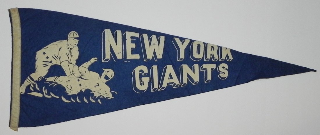 1940's New York Giants Baseball Pennant: This lot is a 1940's New York Giants Baseball Pennant with nice sliding player/fielder motif. The pennant is a 29 inch full sized pennant and features white graphics atop a blue felt.