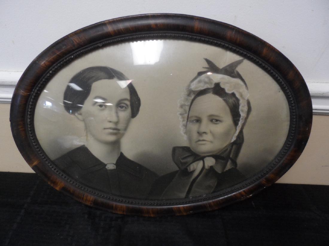 Victorian Era Convexed Frame Charcoal Portrait: Charcoal portait of two ladies in a Victorian era convexed oval frame with original glass. Measures 22" x 16"