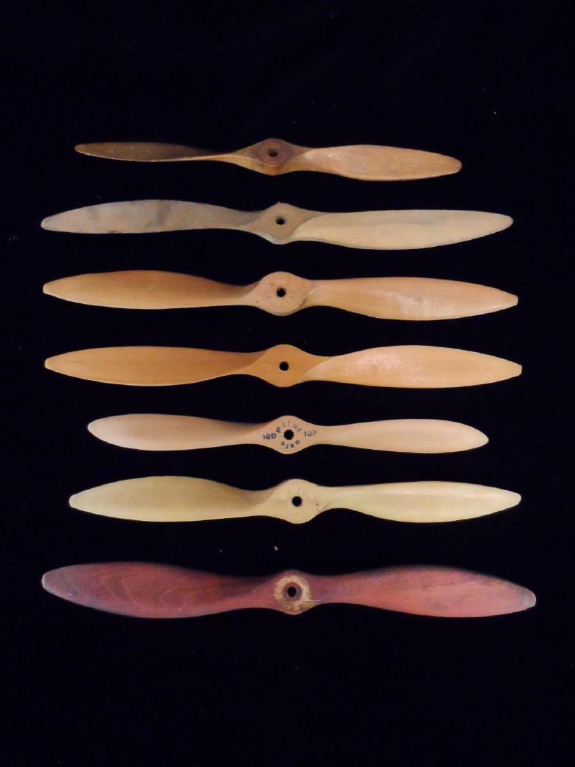 Lot of 7 Vintage Toy Wooden Propellers: Lot of 7 Vintage Toy Wooden Propellers. Props range in size from 10-12" in length. (3) are marked High Trust, (1) marked Pilot, (3) unmarked.
