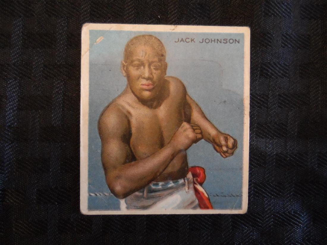 1910 Jack Johnson Hassan Collector Card: 1910 Jack Johnson collector card boxing memorabilia. Front of card depicts Jack Johnson in a forward stance, back of card reads Johnson's personal stats and win loss stats from 1899-1909. Card is Seri