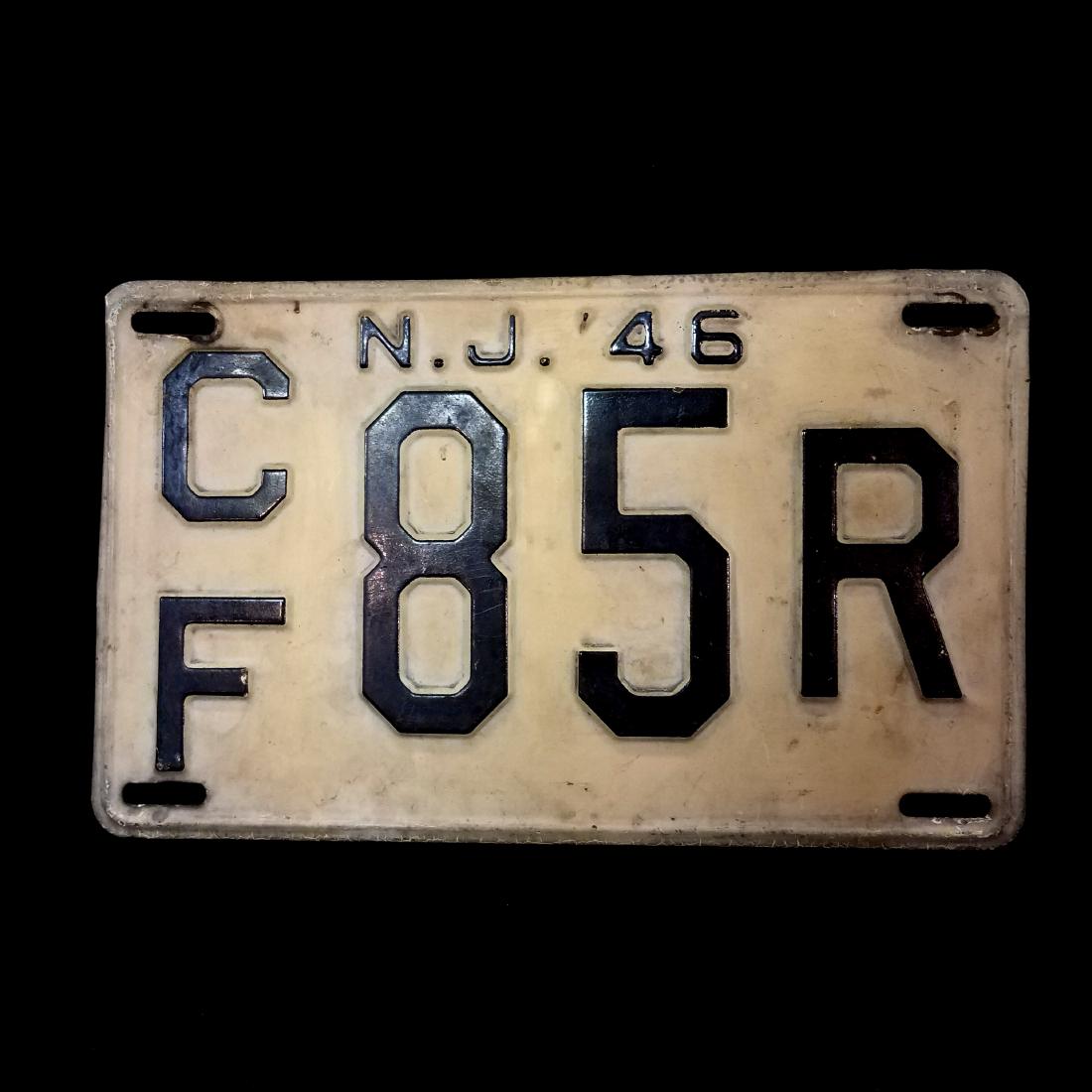 Vintage New Jersey License Plate: Vintage 1946 New Jersey License plate. Plate is in good condition with signs of normal use. Tag Number CF 85R. Measures 10.75x6.5"