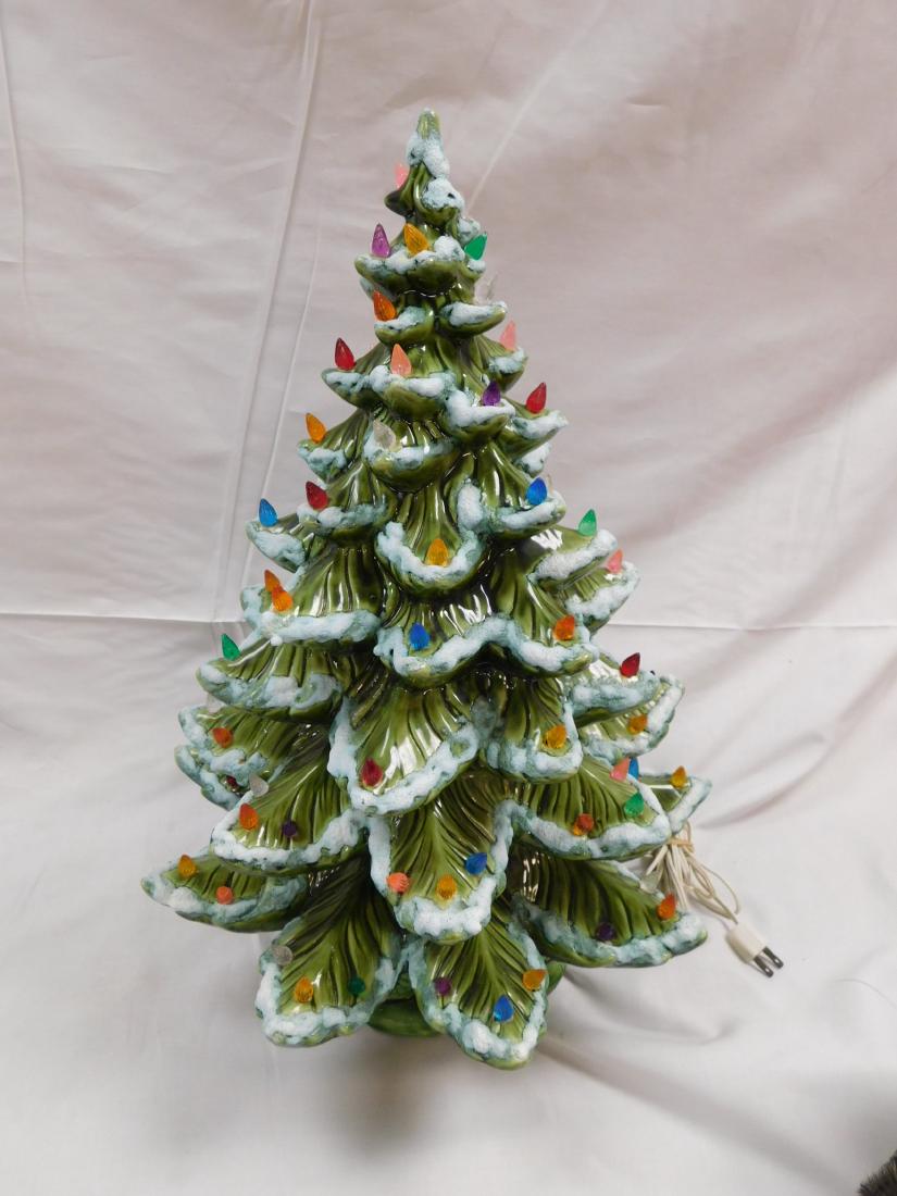 Vintage Ceramic Christmas Tree: Vintage lighted ceramic flocked christmas tree made by Atlantic Mold. Tree is in excellent condition with no chips or cracks and in working order. Measures 16" wide at the base of branches x 22" tall.
