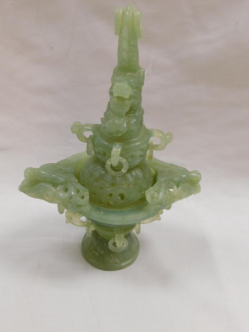 Antique Carved Jade Incense Burner: Antique Carved Jade Incense Burner. Each piece is intricately carved from a single piece of jade. In excellent condition with one repaired ring. Measures 10" tall, widest point 7".
