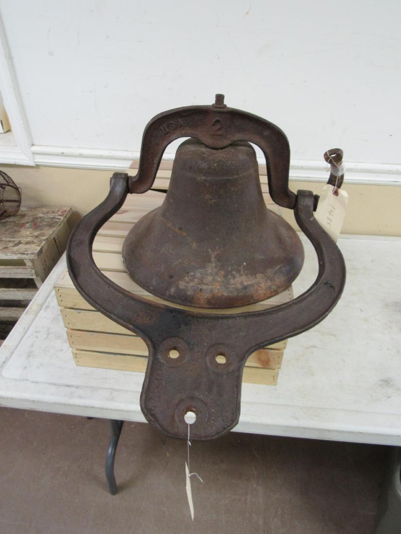 Antique Cast Iron Number 2 Farm Bell: Antique Cast Iron Number 2 Farm Bell. In excellent condition with original cradle and clacker. Marked USA 2. Measures 15" across.
