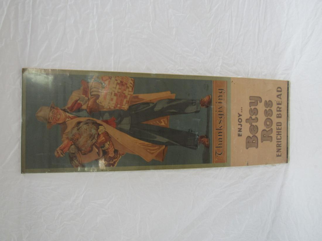 Betsy Ross Bread Paper Advertising: Betsy Ross Bread Thanksgiving Paper Advertising. NOS. Sign depicts a man coming home with a turkey and all the fixings. Art by Frank Dillon. Measures 34.5 x 12"