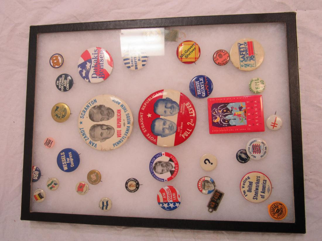 Lot of Political and Advertising Pins: Lot of Vintage Political and Advertising Pins. Pins include Kennedy, Robert Dole, Bush/Quayle, etc. Comes in shadow box. Box measures 16.5 x 12.5"