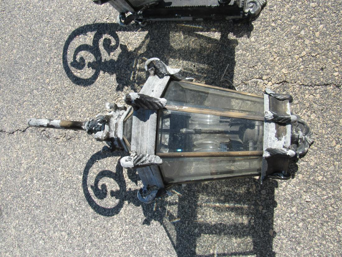 Pair of Ornate Outdoor Sconces: Pair of Ornate Outdoor Sconces. Sconces came off a large estate home in St. Augustine, Fl. 4 lights per sconce. One glass panel broken on one of the sconces. Measures 35" long x 14" wide.
