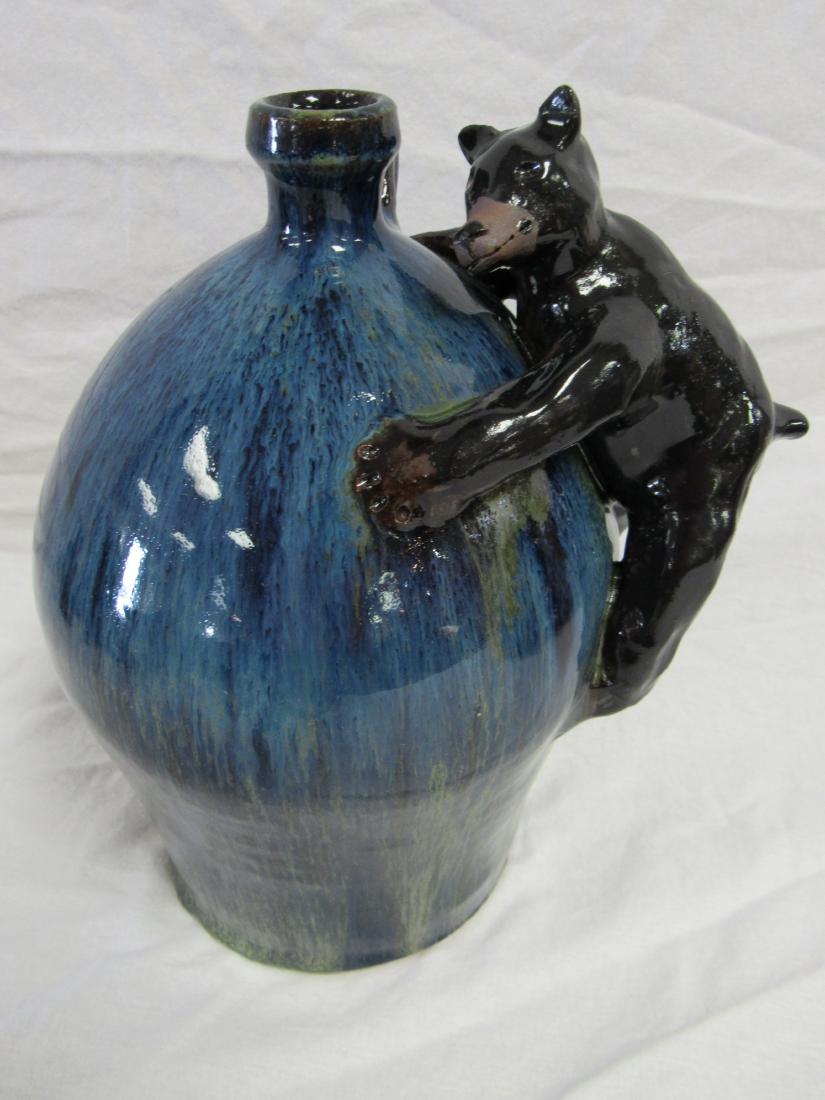 Self Taught/ Folk Artist Marvin Bailey Three Quarter: Self Taught/ Folk Artist Marvin Bailey out of Lancaster, SC Three Quarter Gallon Bear Jug. Blue and Green Glazed with Black Bear Hanging on the Signed. Signed Marvin Bailey. 9.5" tall. Excellent Condi