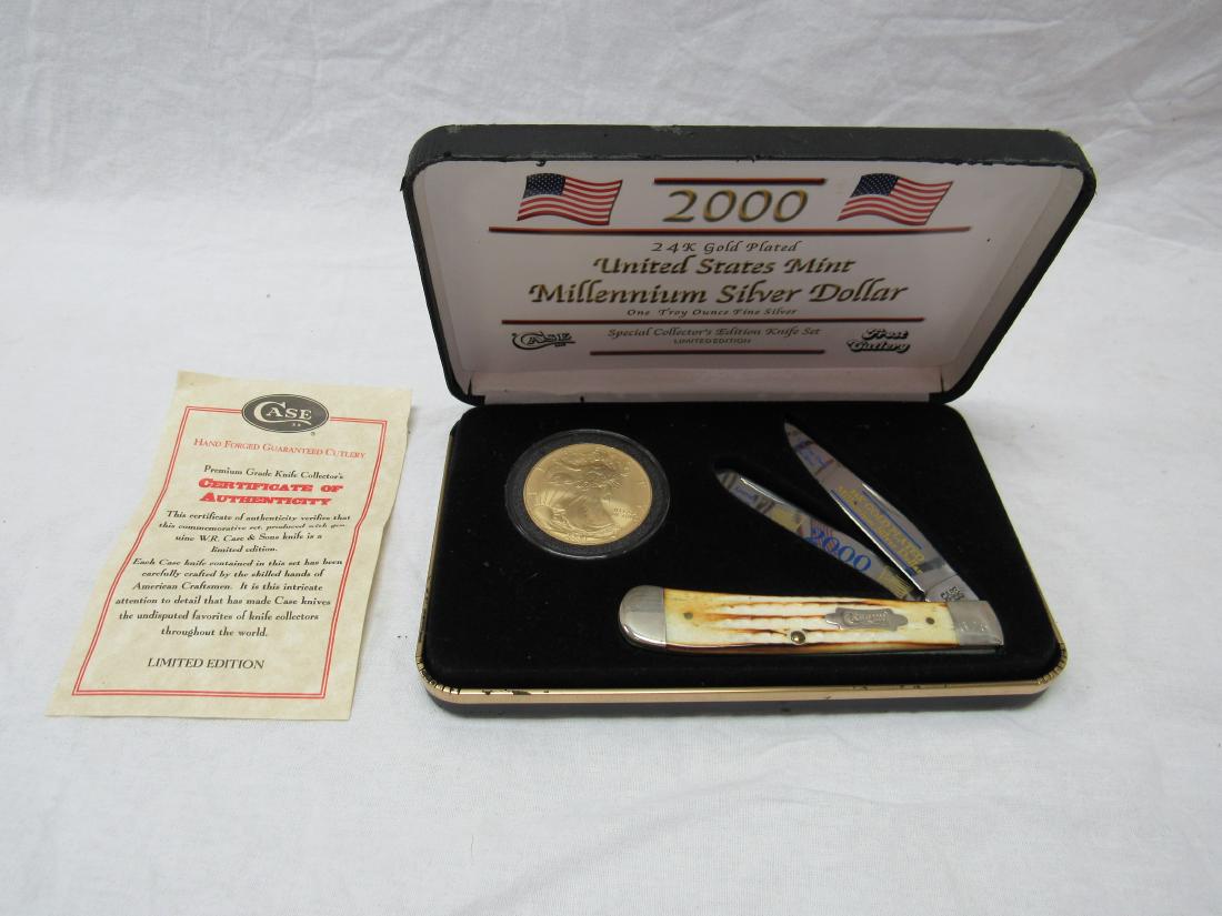 Millennium US Silver AmEagle Dollar and Case Knife Set: Millennium US Mint Silver American Eagle Dollar and Case Knife Set. In presentation case. 2 blade trapper style stag handle case knife with certificate of authenticy. Excellent condition.