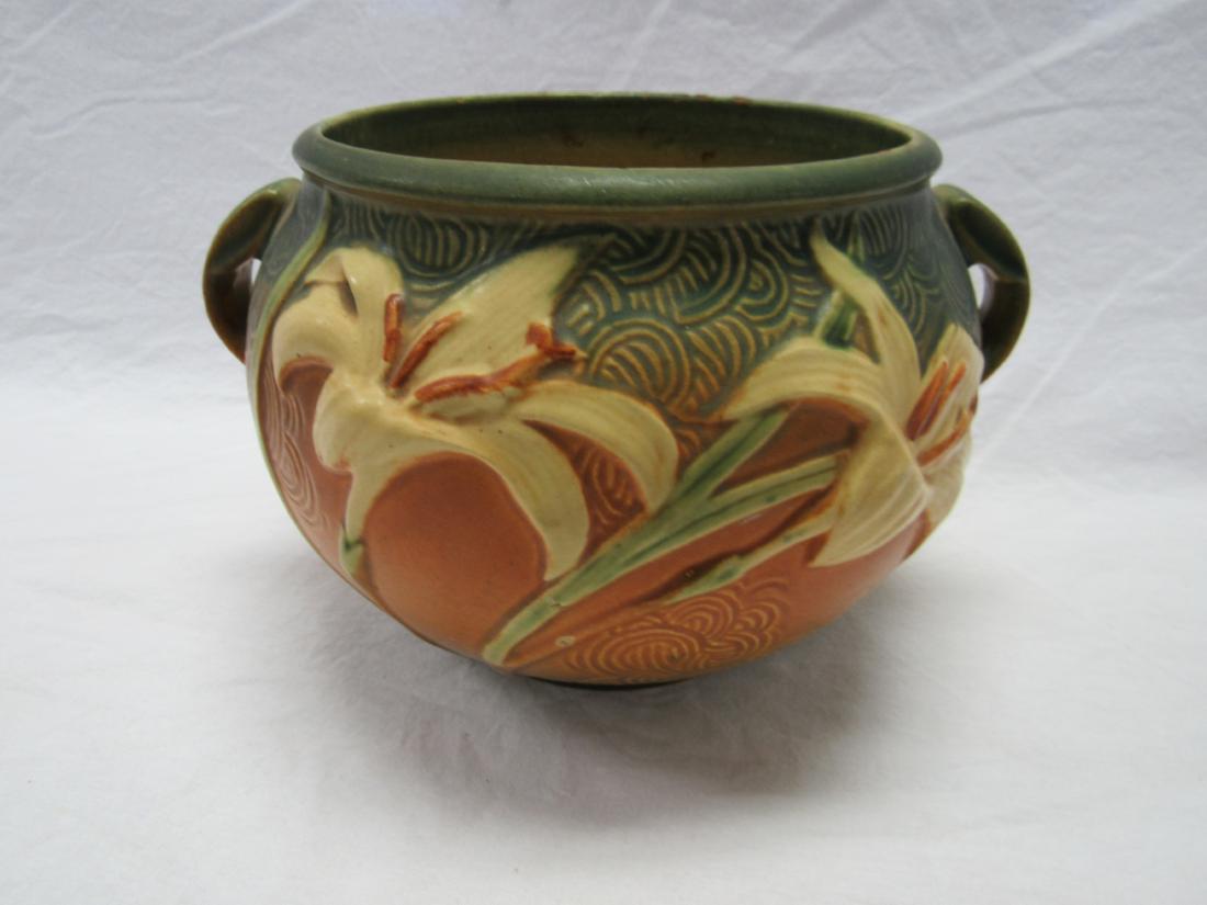 Roseville 6 Inch Zephyr Lily Vase: Roseville 6 Inch Zephyr Lily Vase. Good condition. Minor chip and some flaking as photographed.