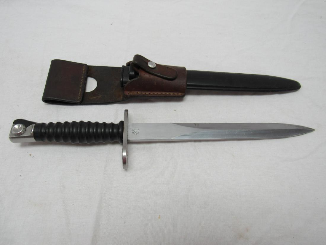 Swiss Model 1957 Pattern Bayonet: Swiss Model 1957 Pattern Bayonet. Blade length 9.4" Handle length 4.88". Overall 14.6". Manufactured by Waffenfabrik Neuhausen, Wenger. Bayonet is double edged and unfullerd. In original sheath. Excel