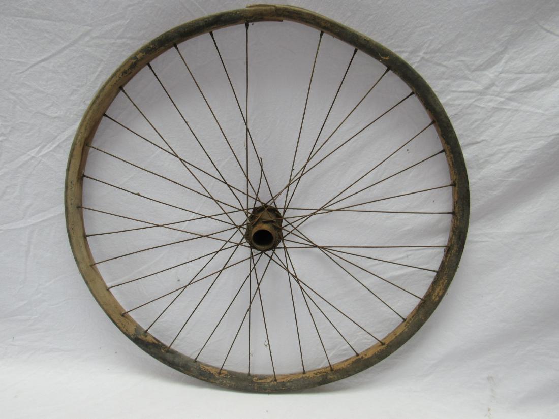 Antique Wooden Bicycle Wheel: Antique Wooden Bicycle Wheel. Constructed of all wood with metal spokes. 1 spoke broken as photographed. Very good condition. 24".