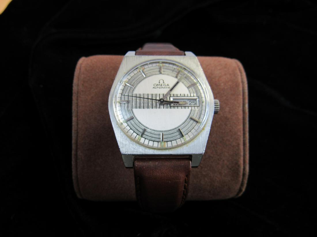 Vintage Omega Automatic Mens Wrist Watch: Stainless Steel Case. In excellent working condition. Face back reads, "Living Well is the Best Revenge". Measures 30mm