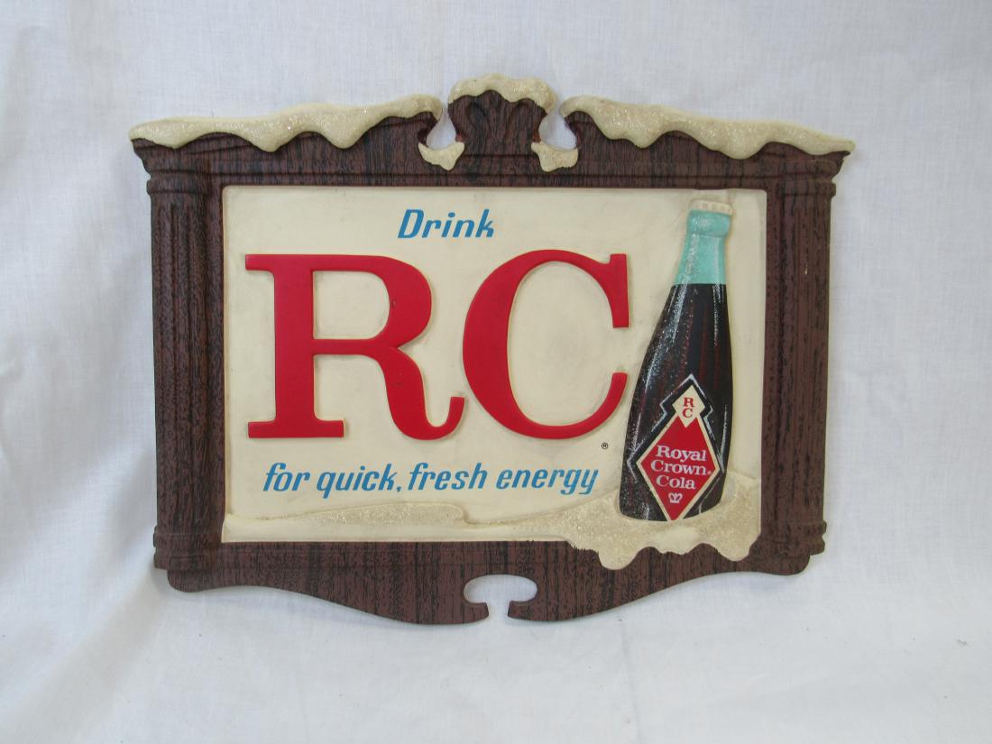 Vintage Drink RC Plastic Sign: Vintage Drink RC Plastic Sign. Sign depicts RC Cola bottle in snow and reads, " Drink RC for quick fresh energy". Measures 14 x 11