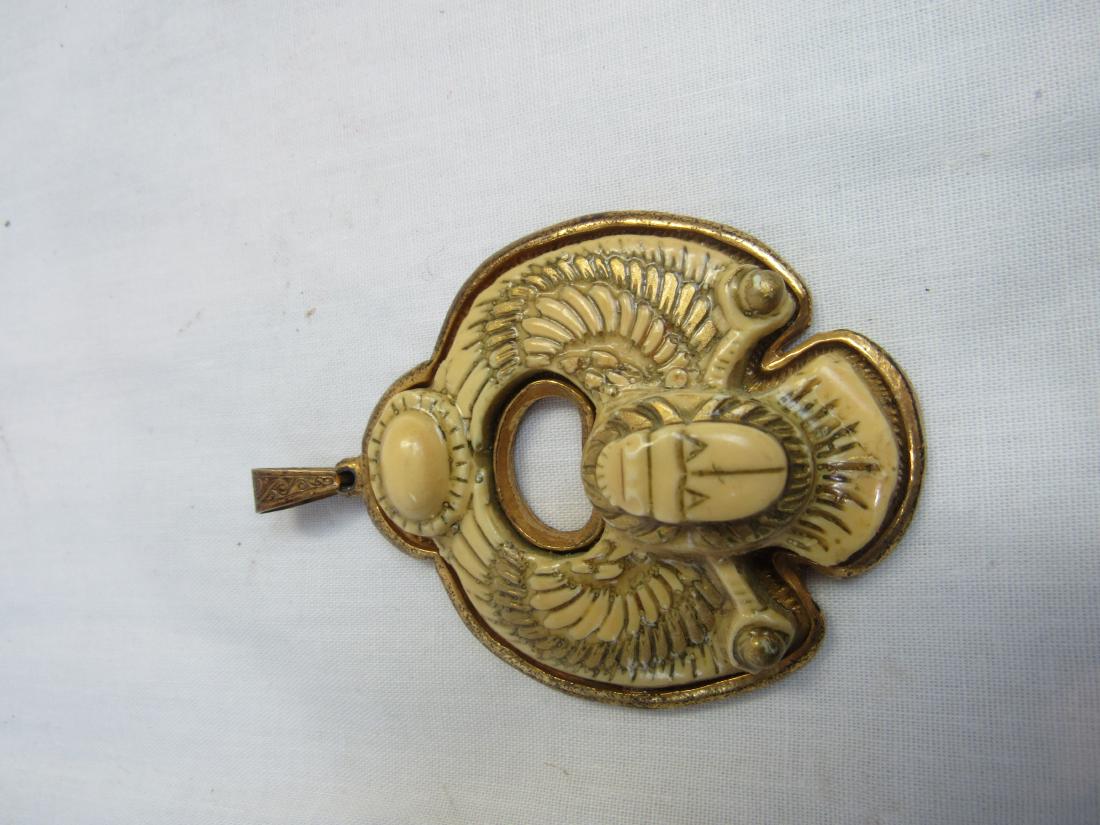 Vintage Miriam Haskell Pendant: Rare Miriam Haskell Egyptian Revival Pendant. Signed on back. In overall good condition. Measures 2.25 x 2.75"