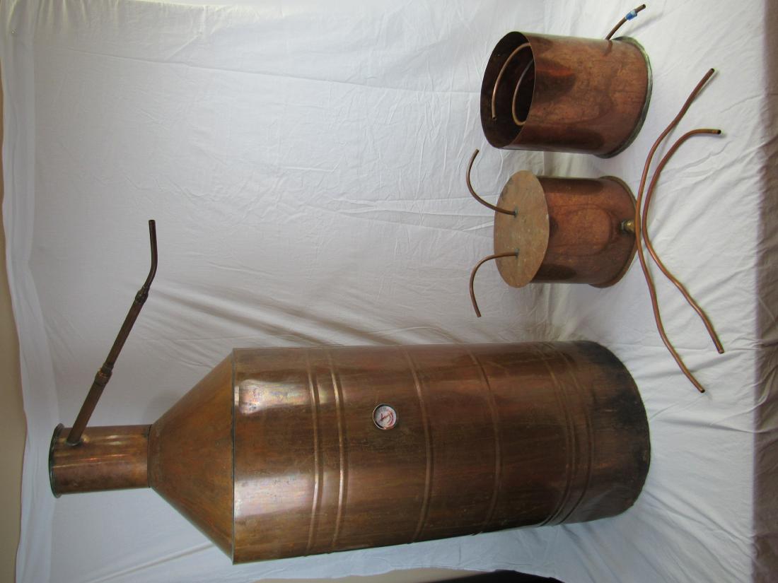 Copper Moonshine Still: Copper Moonshine Still. In very good condition. Pot measures 50" overall height x 18" across bottom.
