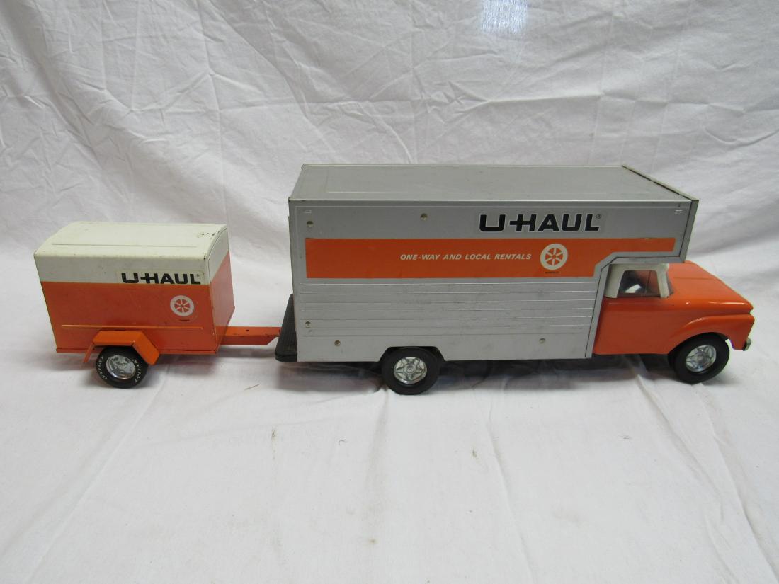 Vintage Ny-Lint Tin U-Haul Truck and Trailer: Vintage Ny-Lint Tin U-Haul Truck and Trailer. In overall very good condition. Truck measures 18.5 x 5.5 x 7.5", trailer 9 x 5.5 x 5"