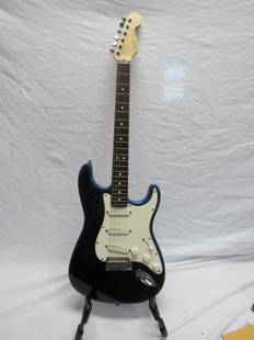 1993 American Made Fender Stratocaster: 1993 American Made Fender Stratocaster. S/N N388914. In overall very good condition. Black and Blue Gradient in color. Comes in soft case