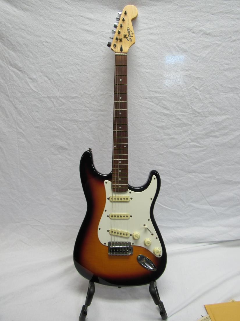 1995 Korean Made Fender Squire Stratocaster: 1995 Korean Made Fender Squire Stratocaster in Sunburst. S/N VN584897In overall very good condition. Comes with soft case.