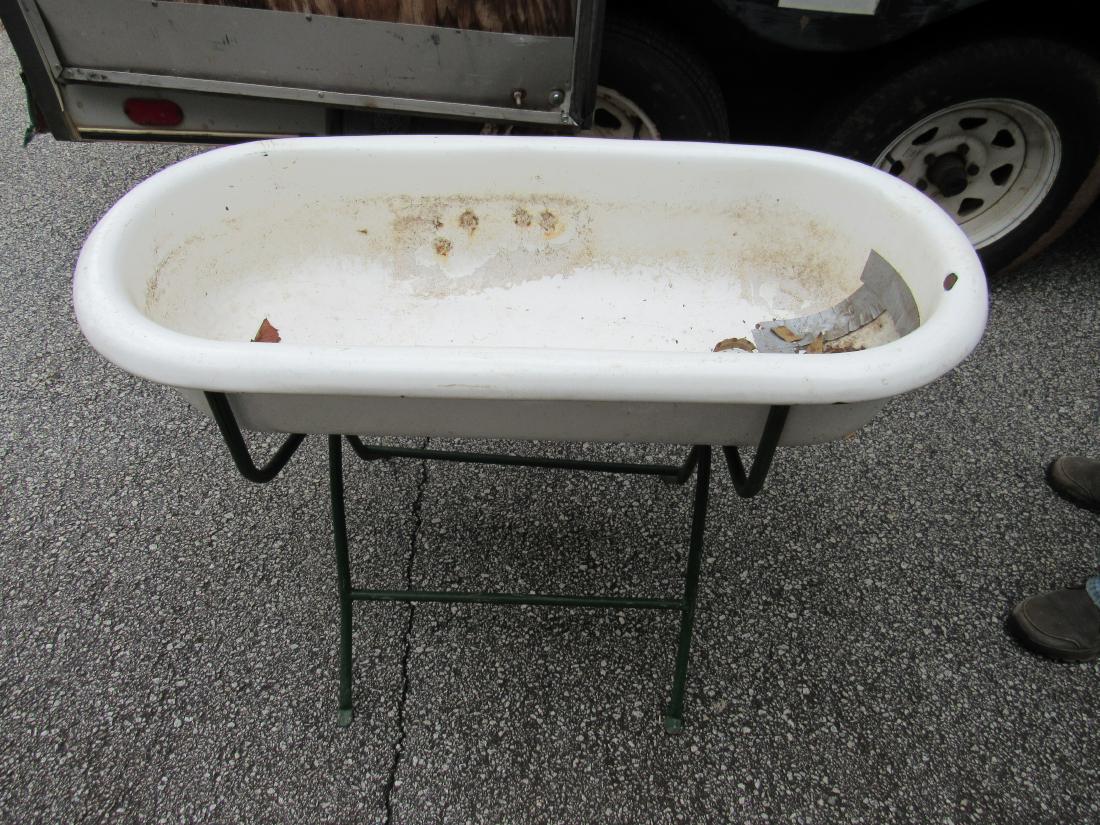Antique Porcelain Baby Tub on Stand: Antique Porcelain Baby Tub on Stand. Made in Hungary. Overall good condition, damage to drain and some chips in porcelain, as photographed. Measures 40 x 18 x 29